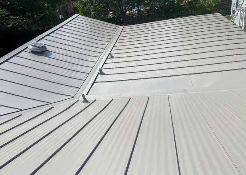 Solar attic fan installed on a metal roof for Roof Ventilation in Fallon